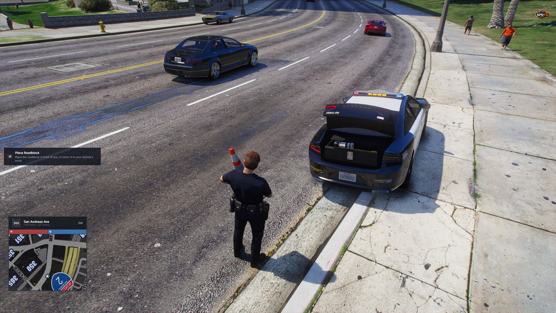 Officer carrying a traffic cone with the H Place Roadblock prompt visible