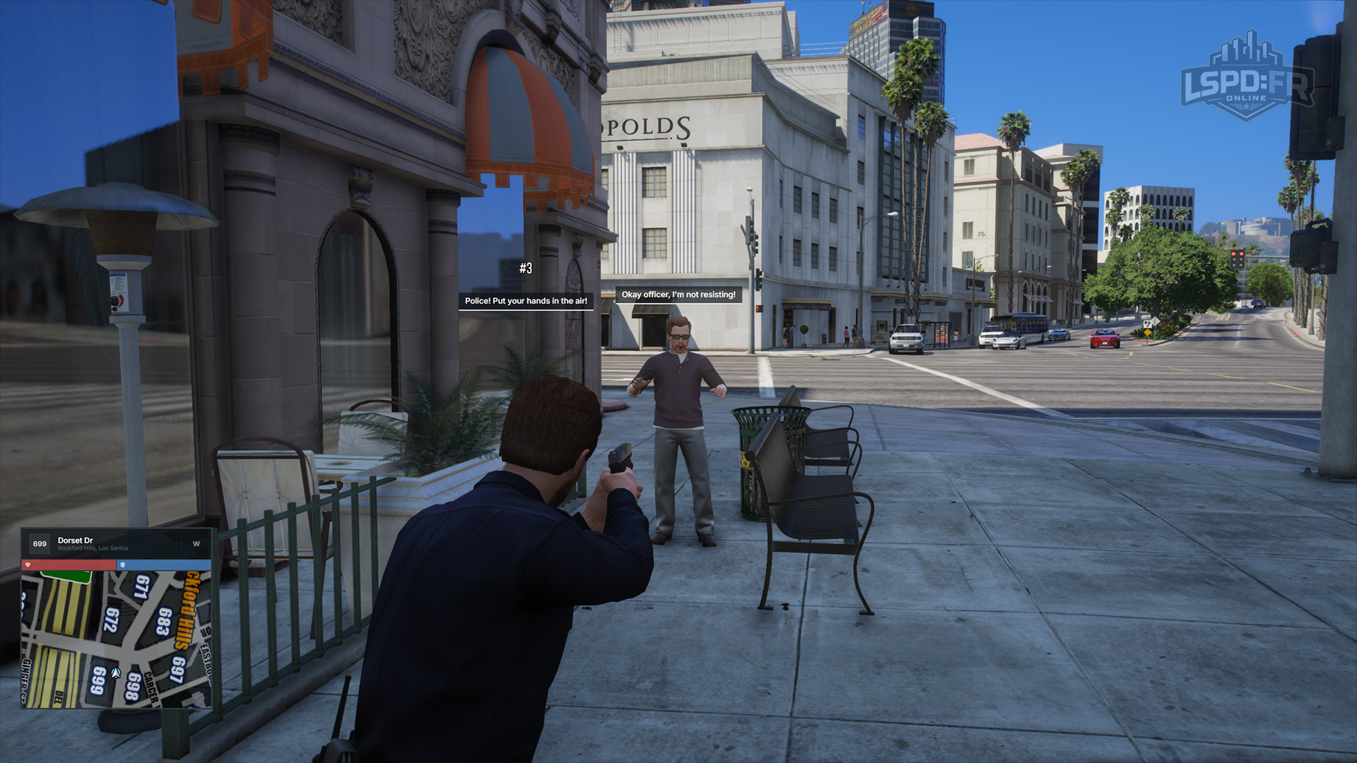 An officer aiming at a suspect and ordering them to surrender