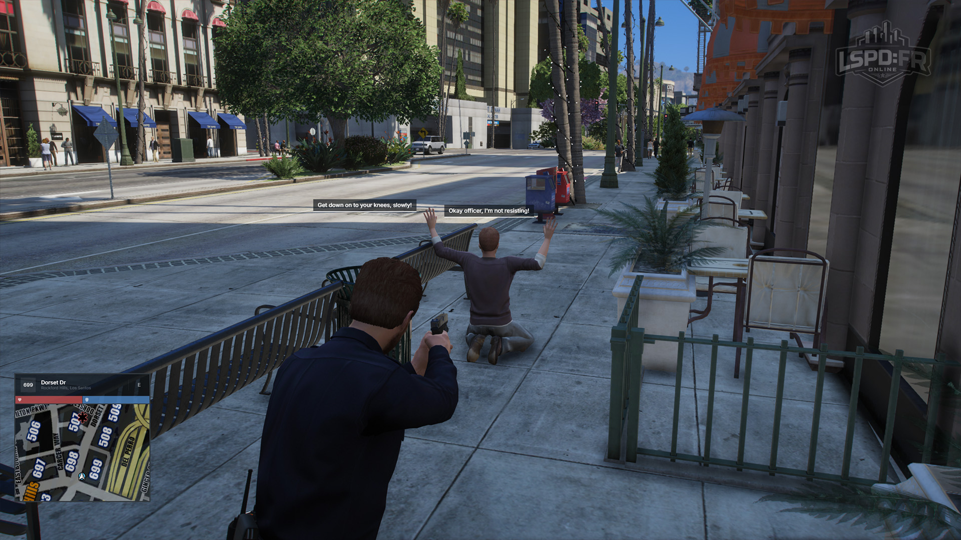 A surrendered suspect ordered down onto their knees